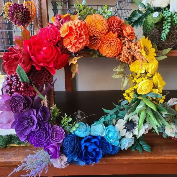 Colorful rainbow flower wreath - creative spring decor ideas with vibrant floral design